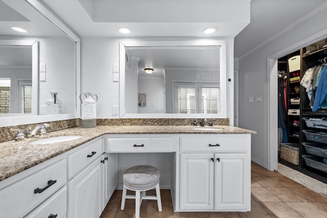 bathroom with vanity, tile patterned flooring, and crown molding