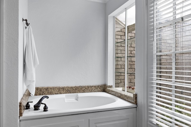 bathroom with a tub to relax in