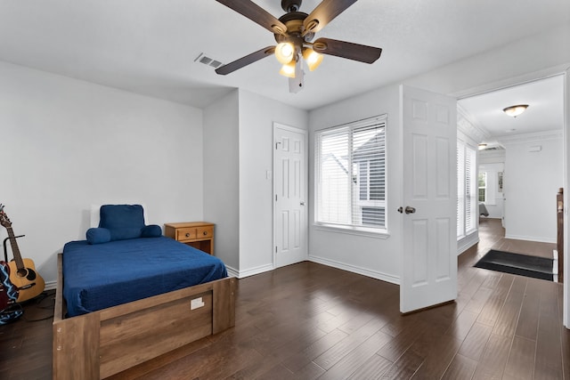 bedroom featuring dark wood-type flooring and ceiling fan