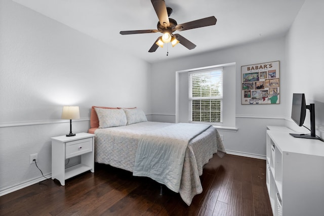 bedroom with dark hardwood / wood-style flooring and ceiling fan