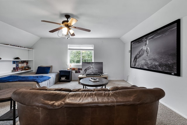 carpeted living room featuring ceiling fan and lofted ceiling