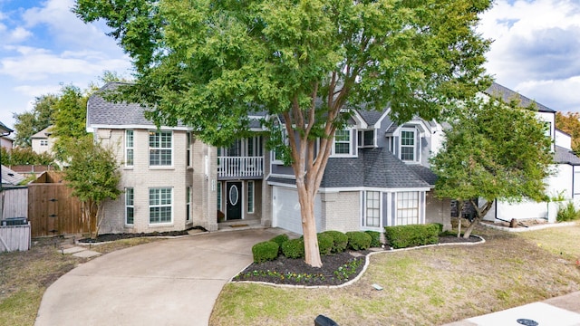 view of front of property featuring a garage and a front yard