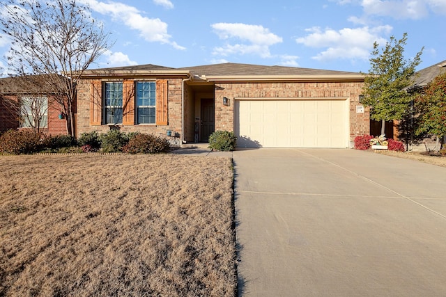 ranch-style home featuring a garage