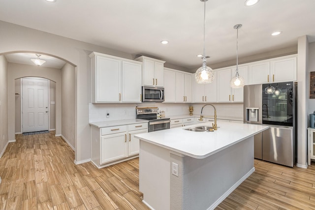 kitchen featuring sink, stainless steel appliances, and white cabinets