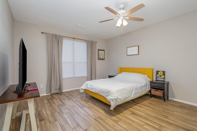 bedroom featuring light hardwood / wood-style flooring and ceiling fan