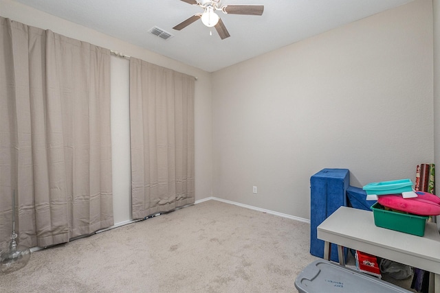 miscellaneous room with ceiling fan and carpet flooring