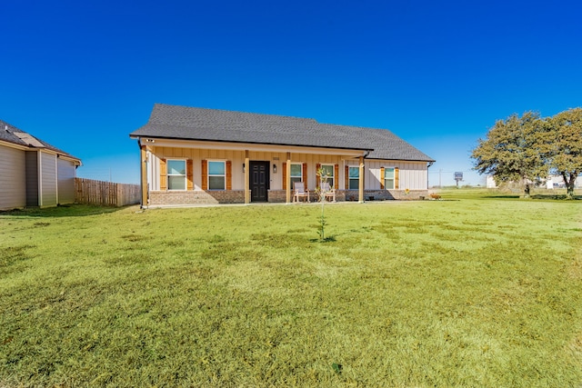 3010 Morris Rd, Mabank, TX 75147 - back of house with board and batten siding, a porch, and a shingled roof