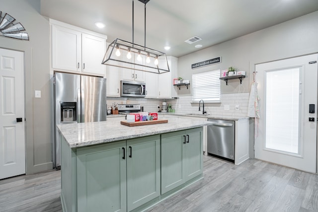 3010 Morris Rd, Mabank, TX 75147 - kitchen with stainless steel appliances, a sink, decorative backsplash, white cabinets, and recessed lighting