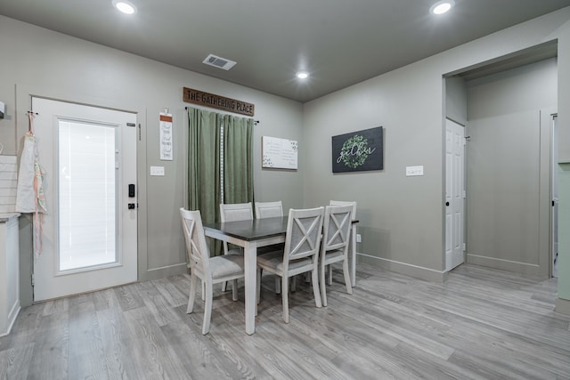 dining area with light wood-type flooring