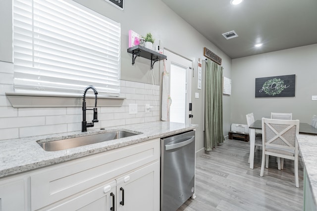 3010 Morris Rd, Mabank, TX 75147 - kitchen featuring dishwasher, a sink, decorative backsplash, white cabinetry, and recessed lighting