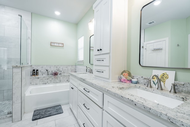 3010 Morris Rd, Mabank, TX 75147 - bathroom featuring tile patterned floors, a bath, a tile shower, double vanity, and recessed lighting