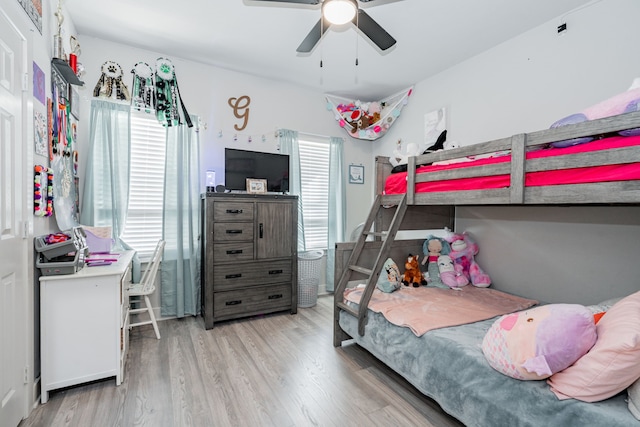 bedroom with ceiling fan and light hardwood / wood-style flooring