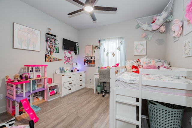 bedroom featuring light hardwood / wood-style floors and ceiling fan