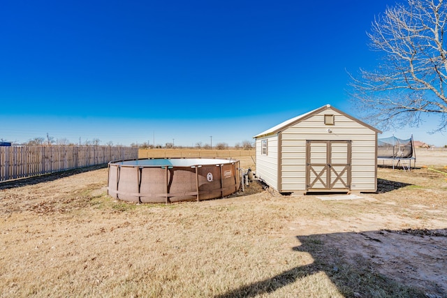 3010 Morris Rd, Mabank, TX 75147 - view of shed with a trampoline and fence