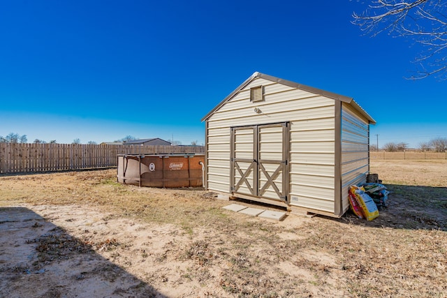 view of outbuilding featuring a pool