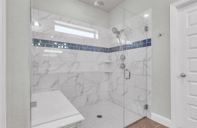 bathroom featuring tile patterned flooring and a shower with shower door