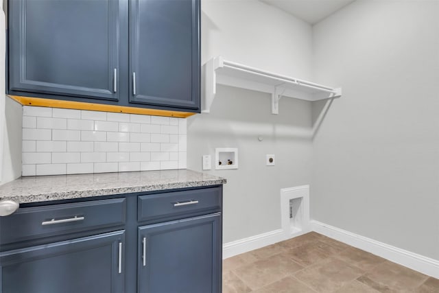 clothes washing area featuring hookup for an electric dryer, washer hookup, cabinet space, baseboards, and gas dryer hookup