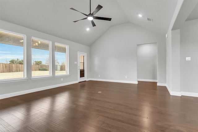 empty room featuring high vaulted ceiling, dark wood-type flooring, and ceiling fan