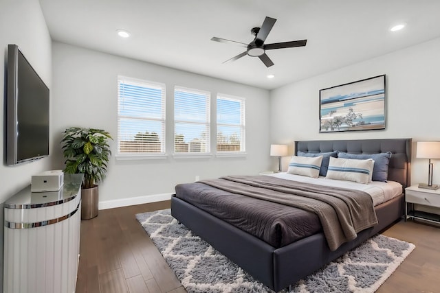 bedroom with a ceiling fan, recessed lighting, wood finished floors, and baseboards