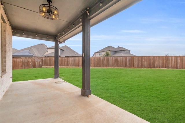 view of yard with a patio area and a fenced backyard