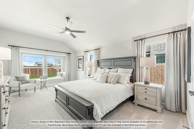 carpeted bedroom with vaulted ceiling and ceiling fan