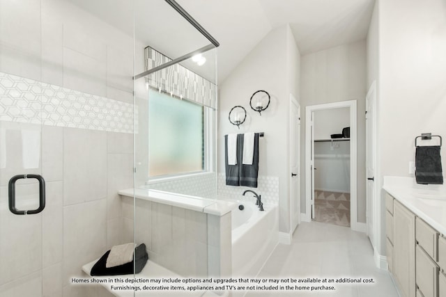 bathroom with tile patterned floors, separate shower and tub, and vanity