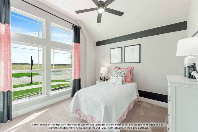 carpeted bedroom with lofted ceiling and ceiling fan