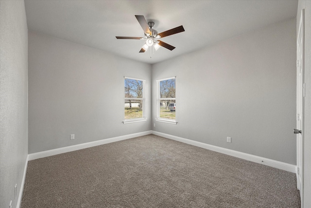 carpeted empty room featuring ceiling fan