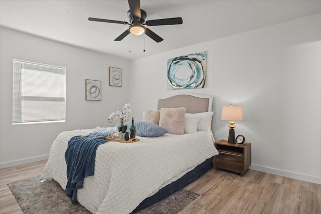 bedroom featuring ceiling fan and light wood-type flooring