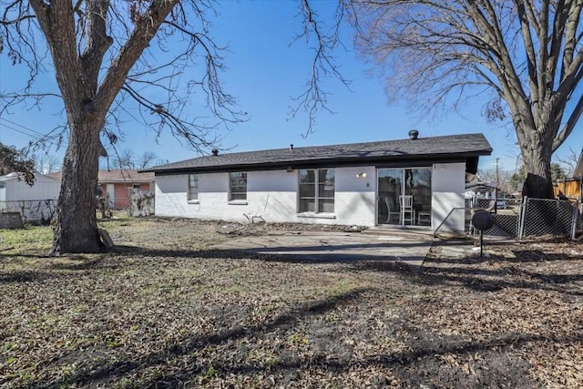 back of property with a patio area