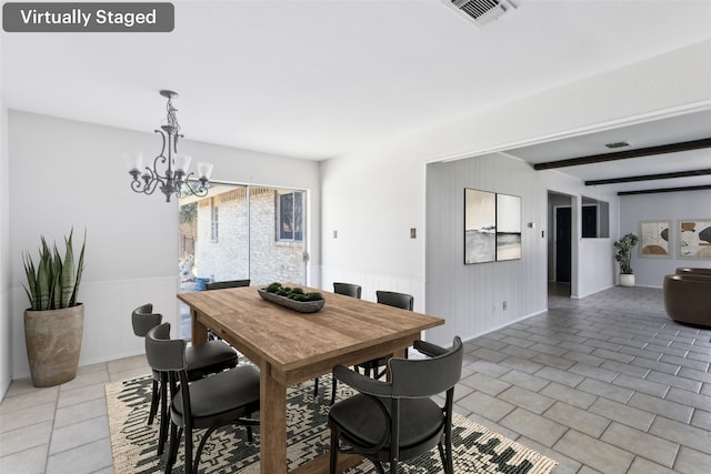 dining room with light tile patterned floors, a notable chandelier, visible vents, wainscoting, and beamed ceiling