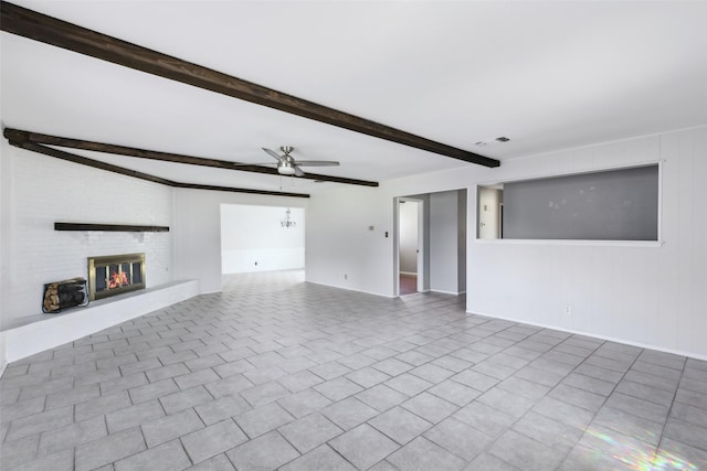 unfurnished living room featuring light tile patterned floors, visible vents, ceiling fan, beamed ceiling, and a brick fireplace