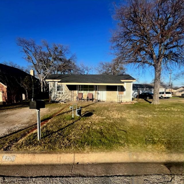 ranch-style house with a front yard