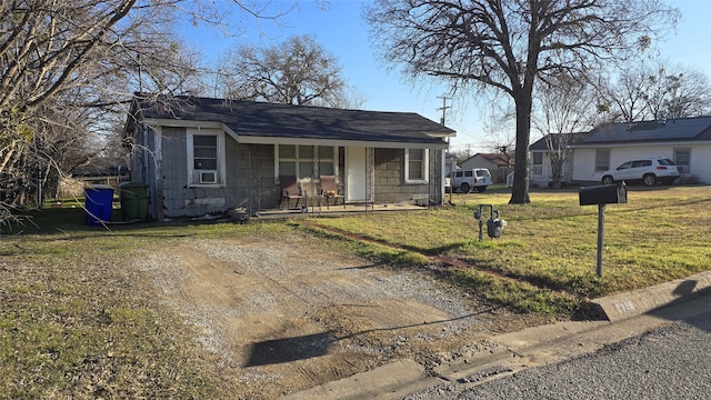 view of front of property featuring a front lawn and a porch