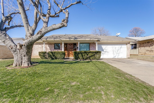 ranch-style home with a garage and a front lawn