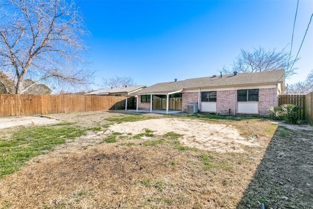 back of house with central AC unit and a patio area