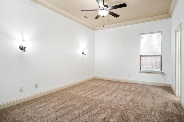 carpeted empty room featuring crown molding and ceiling fan