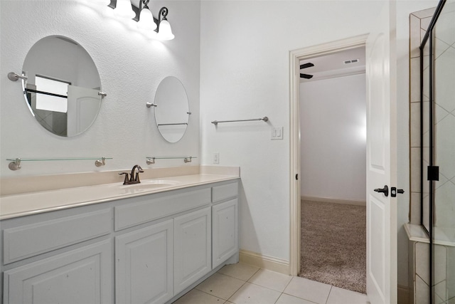 bathroom featuring tile patterned flooring and vanity