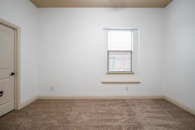 empty room featuring carpet flooring