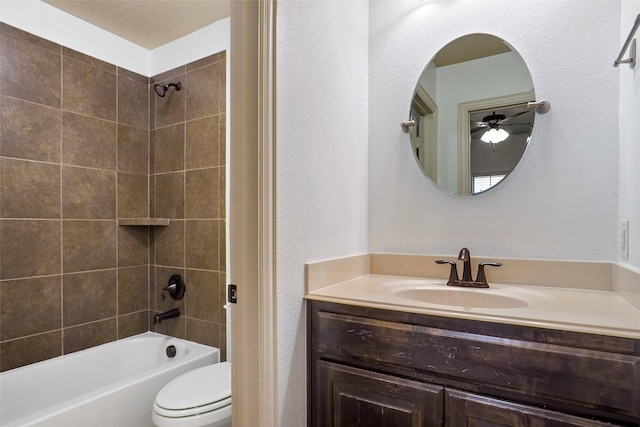 full bathroom featuring vanity, toilet, and tiled shower / bath