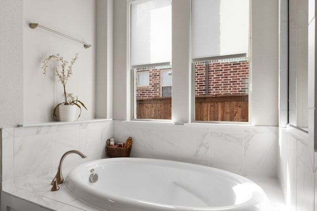 bathroom with a tub to relax in