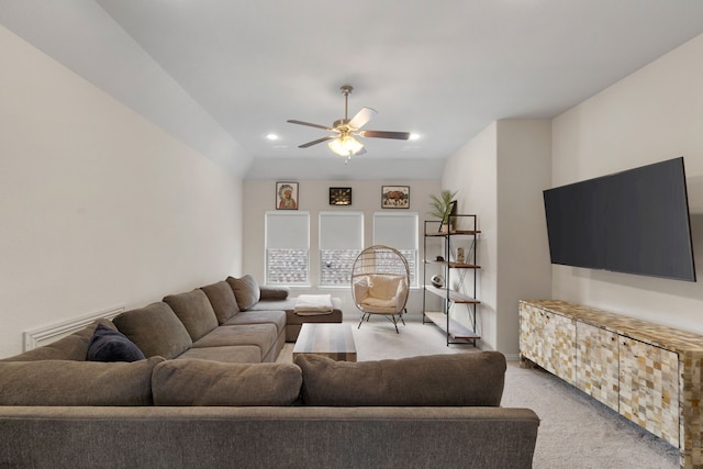 carpeted living room featuring ceiling fan