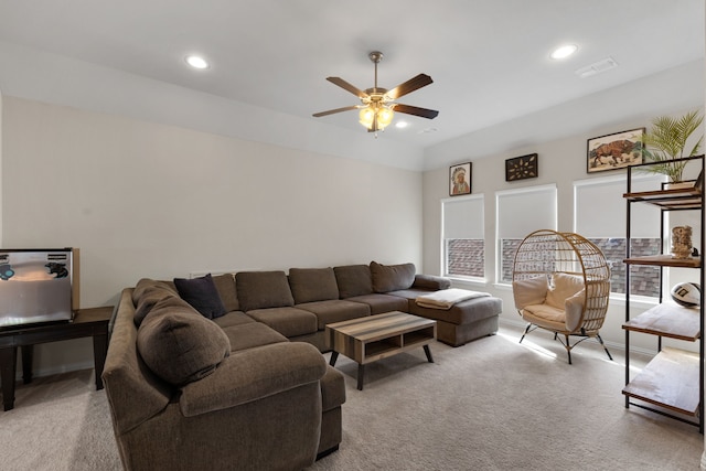 living room with light colored carpet and ceiling fan