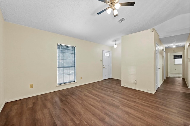 unfurnished living room with dark wood-type flooring, ceiling fan, and a textured ceiling