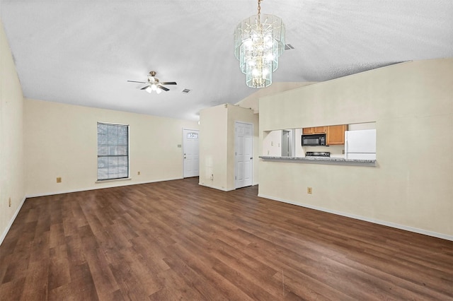 unfurnished living room featuring vaulted ceiling, dark hardwood / wood-style floors, ceiling fan with notable chandelier, and a textured ceiling