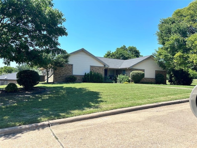 ranch-style house with a front yard