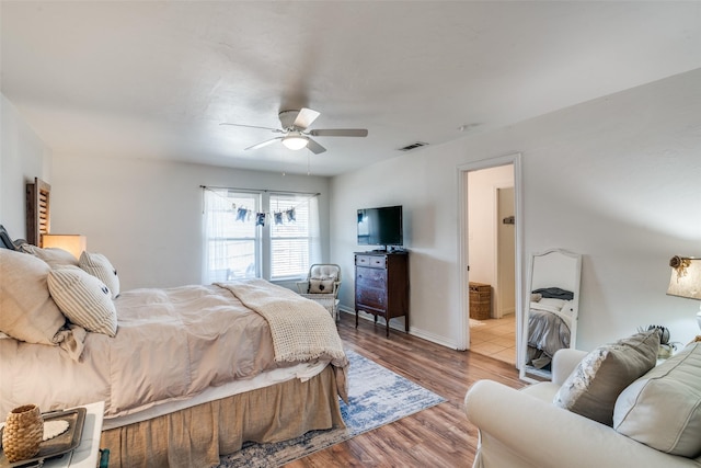 bedroom with ceiling fan and light wood-type flooring