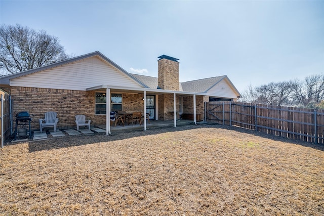 back of house with a patio