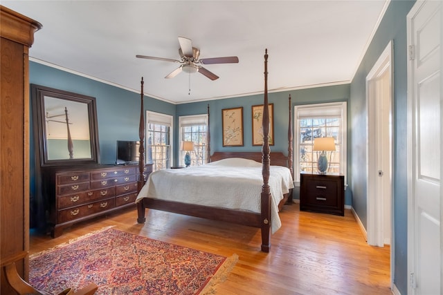 bedroom with ceiling fan, ornamental molding, and light hardwood / wood-style floors