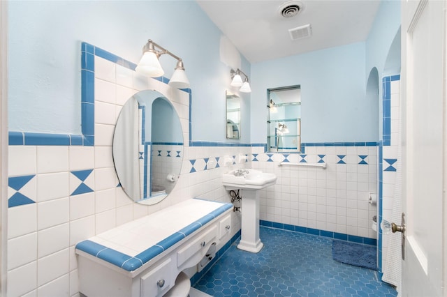 bathroom featuring tile walls and tile patterned floors